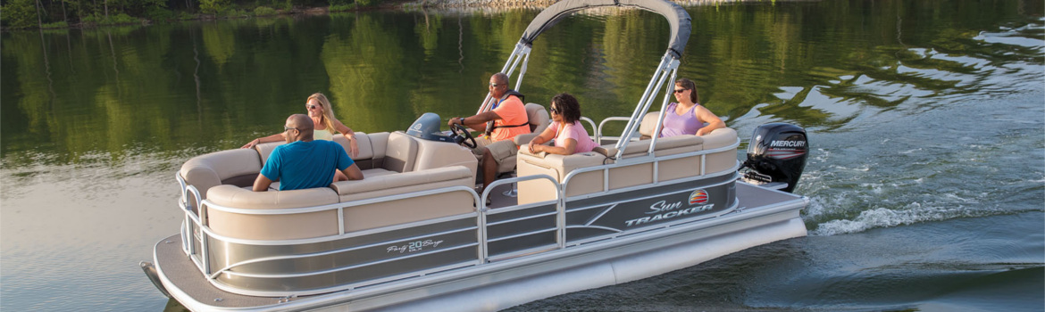 A group of 5 people on a 2018 Sun Tracker Party Barge 20 DLX pontoon boat cruising on a river.